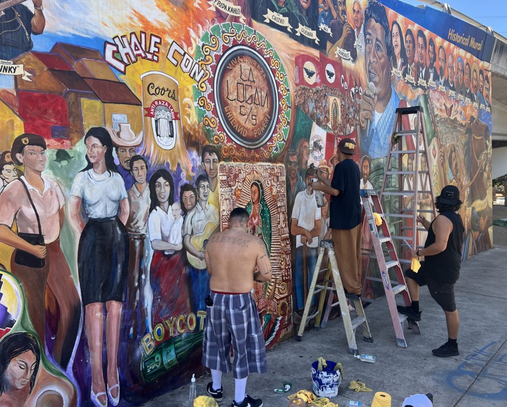 Barrio Logan community gathers to remove racist graffiti from Chicano Park mural